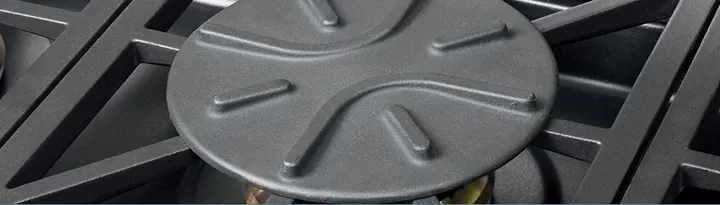 Gas cooker burner with a simmer plate