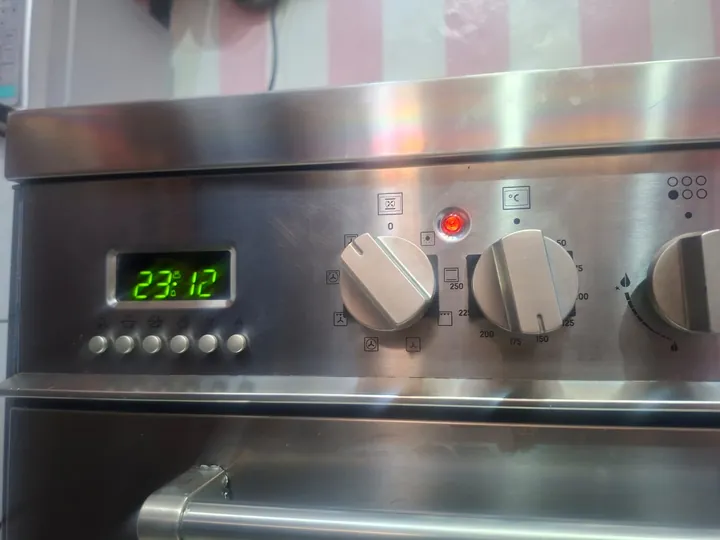 Stainless range cooker control panel with clock