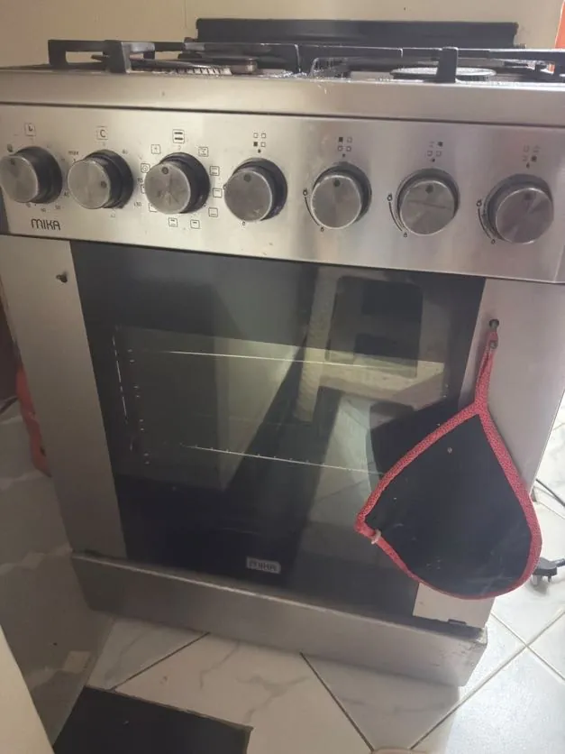 Stainless freestanding cooker with oven repaired at a client home