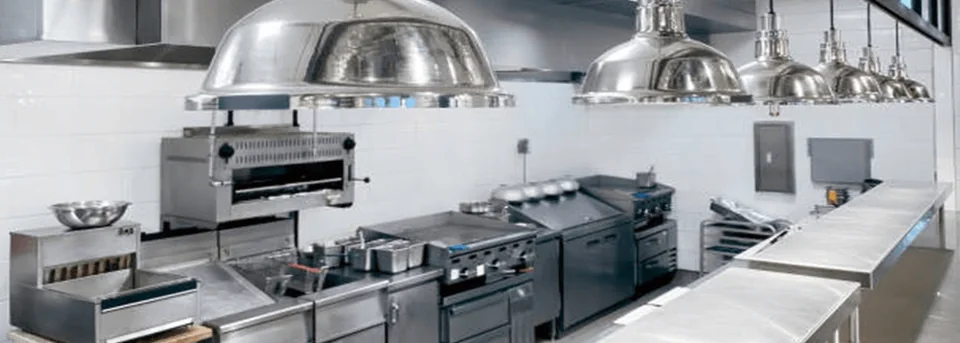 Hotel kitchen line with ranges, hoods and heat lamps